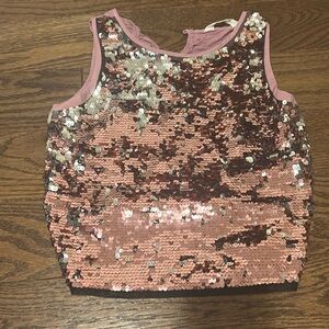 Really cute top the little things flip and change colors once flipped